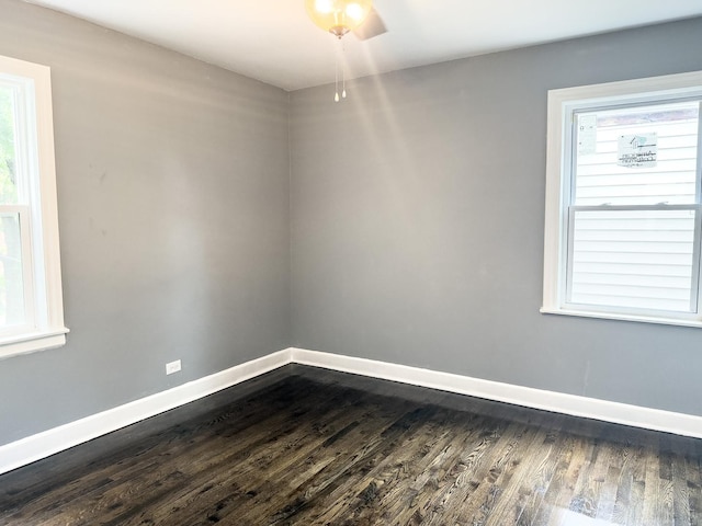 8517 S Wallace St, Chicago, IL 60620 - spare room featuring dark wood-style floors and baseboards