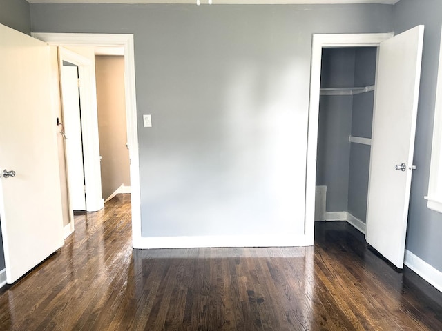 8517 S Wallace St, Chicago, IL 60620 - unfurnished bedroom with dark wood-style flooring and baseboards