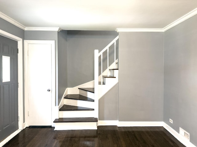 8517 S Wallace St, Chicago, IL 60620 - entryway with dark wood finished floors, stairs, and crown molding