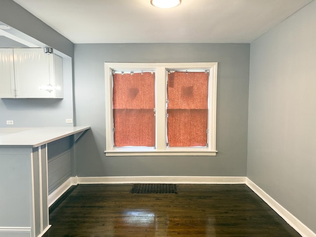 8517 S Wallace St, Chicago, IL 60620 - unfurnished dining area with baseboards and dark wood-style flooring