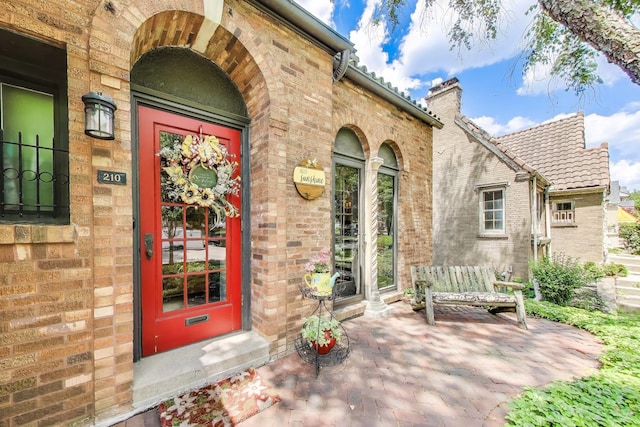210 Berry Pkwy, Park Ridge, IL 60068 - property entrance featuring brick siding and a chimney