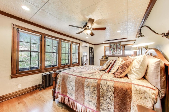 210 Berry Pkwy, Park Ridge, IL 60068 - bedroom featuring ornamental molding, a wall mounted AC, light wood finished floors, radiator, and recessed lighting