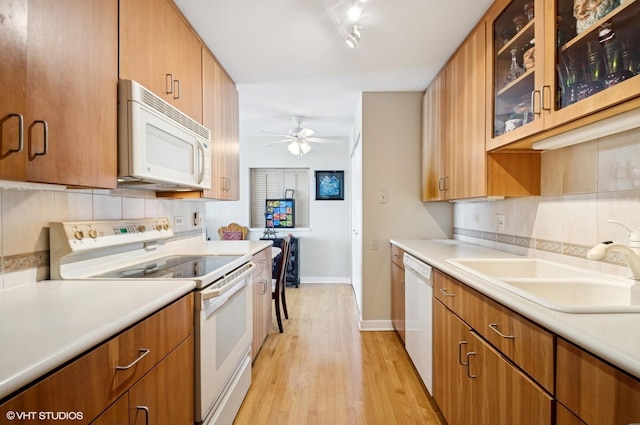 1110 N Lake Shore Dr Unit 20S, Chicago, IL 60611 - kitchen with white appliances, a ceiling fan, light countertops, and light wood-style flooring