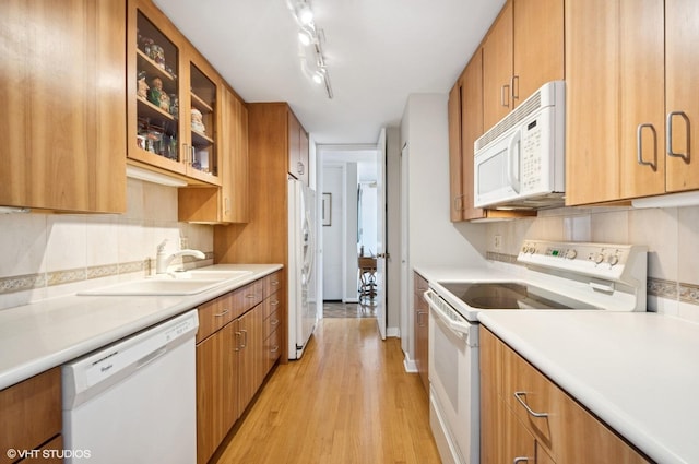 1110 N Lake Shore Dr Unit 20S, Chicago, IL 60611 - kitchen with white appliances, light wood-style flooring, light countertops, and glass insert cabinets