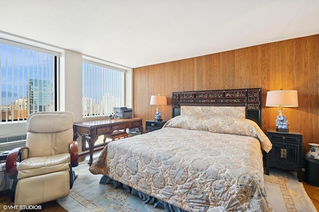1110 N Lake Shore Dr Unit 20S, Chicago, IL 60611 - bedroom with wood finished floors, a view of city, and wood walls