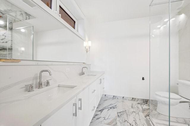 1352 W Diversey Pkwy Unit 2, Chicago, IL 60614 - bathroom featuring marble finish floors, double vanity, and a marble finish shower