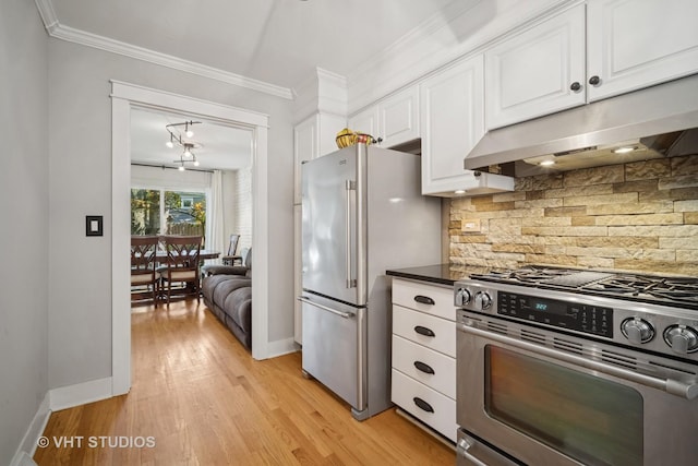 313 Hawthorn Ave Unit F, Glencoe, IL 60022 - kitchen featuring stainless steel appliances, under cabinet range hood, decorative backsplash, white cabinets, and crown molding