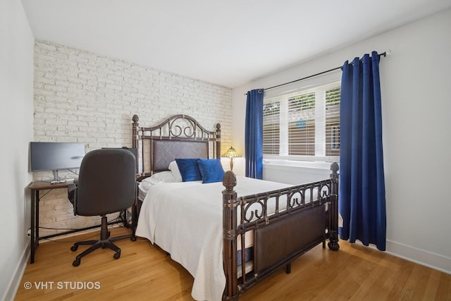 313 Hawthorn Ave Unit F, Glencoe, IL 60022 - bedroom with wood finished floors and brick wall