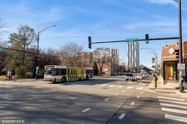 5514 S Woodlawn Ave Unit 406, Chicago, IL 60637 - view of asphalt street with traffic lights, street lighting, traffic signs, sidewalks, and curbs