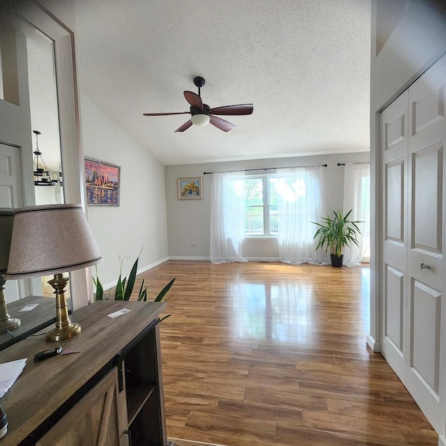 614 Lyon Ct, Buffalo Grove, IL 60089 - office area with a ceiling fan, lofted ceiling, a textured ceiling, and wood finished floors