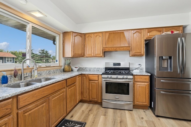 3551 Marseilles Ln, Hazel Crest, IL 60429 - kitchen featuring appliances with stainless steel finishes, custom range hood, light stone countertops, and light wood-type flooring
