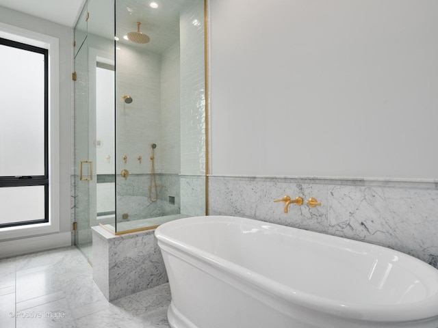 2832 N Racine Ave Unit 2W, Chicago, IL 60657 - bathroom with a marble finish shower, a freestanding bath, and recessed lighting