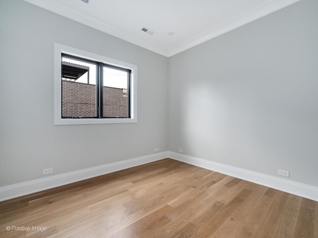 2832 N Racine Ave Unit 2W, Chicago, IL 60657 - spare room with crown molding and light wood-style flooring
