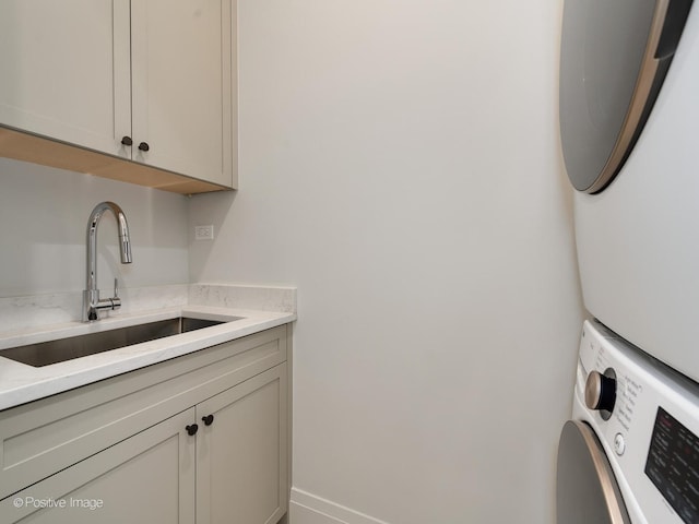 2832 N Racine Ave Unit 2W, Chicago, IL 60657 - laundry area featuring stacked washer / dryer and cabinet space