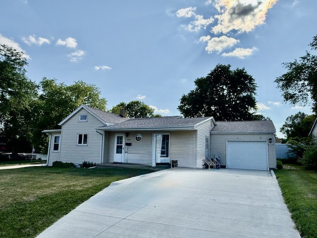 2503 Main St, Peru, IL 61354 - view of front of property with an attached garage, driveway, a front yard, and a chimney