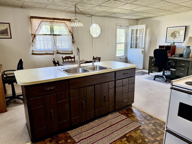 2503 Main St, Peru, IL 61354 - kitchen featuring white electric range, an office area, dark brown cabinetry, and light countertops