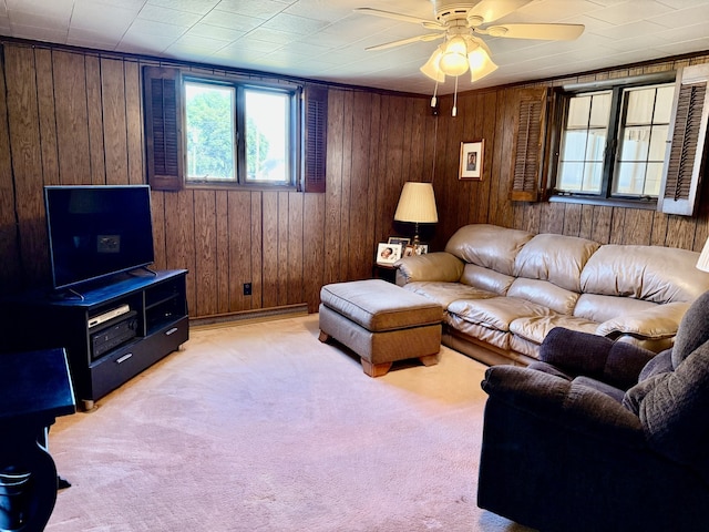 2503 Main St, Peru, IL 61354 - living area featuring a ceiling fan, wood walls, and light carpet