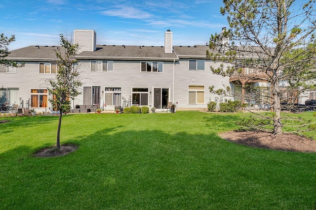 8156 Ripple Ridge Dr, Darien, IL 60561 - rear view of property featuring a lawn and a chimney