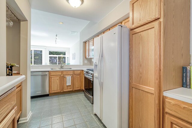 8156 Ripple Ridge Dr, Darien, IL 60561 - kitchen featuring stainless steel appliances, light countertops, and light floors