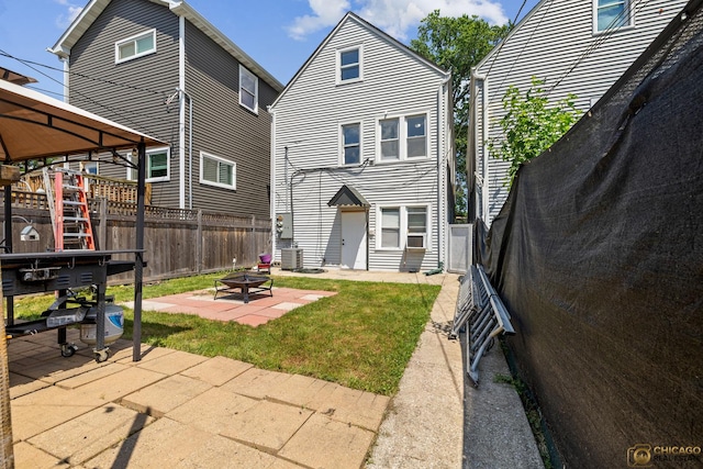 1336 Euclid Ave, Berwyn, IL 60402 - rear view of property with an outdoor fire pit and a patio area