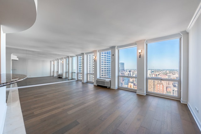 111 E Chestnut St Unit 55D, Chicago, IL 60611 - unfurnished room with plenty of natural light, wood finished floors, crown molding, and a wall of windows