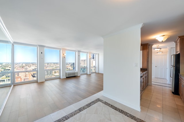 111 E Chestnut St Unit 55D, Chicago, IL 60611 - empty room with ornamental molding and baseboards