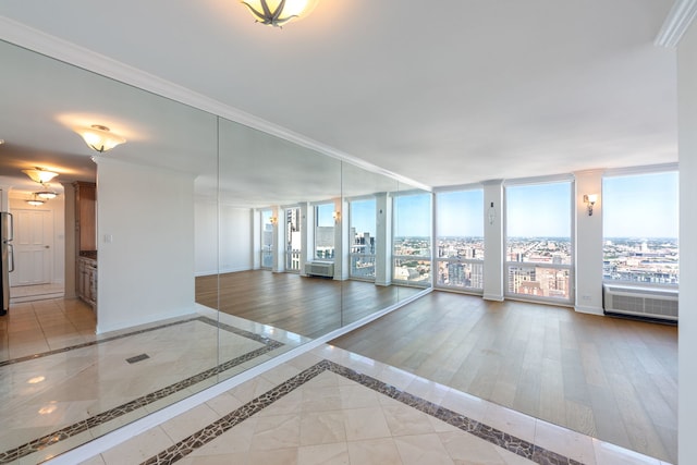 111 E Chestnut St Unit 55D, Chicago, IL 60611 - empty room with inlaid floor details and crown molding