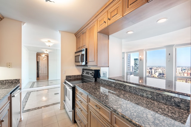 111 E Chestnut St Unit 55D, Chicago, IL 60611 - kitchen with stainless steel appliances, inlaid floor details, plenty of natural light, light tile patterned floors, and recessed lighting