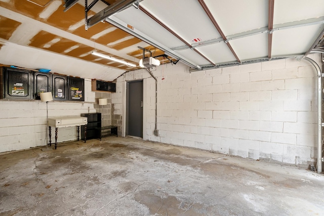 14515 Central Ct Unit Ph1, Oak Forest, IL 60452 - garage with a garage door opener and concrete block wall