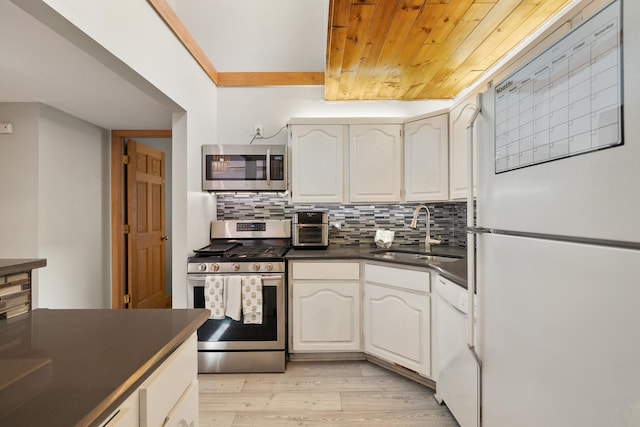 14515 Central Ct Unit Ph1, Oak Forest, IL 60452 - kitchen featuring appliances with stainless steel finishes, dark countertops, light wood-style floors, decorative backsplash, and wood ceiling