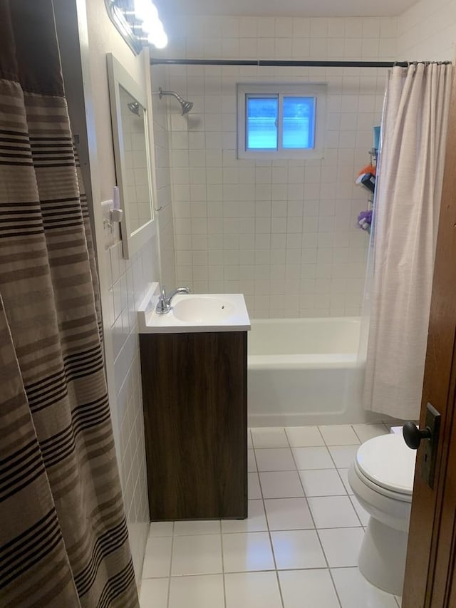 353 W Porter St, Oglesby, IL 61348 - bathroom featuring tile patterned floors, vanity, and shower / tub combo