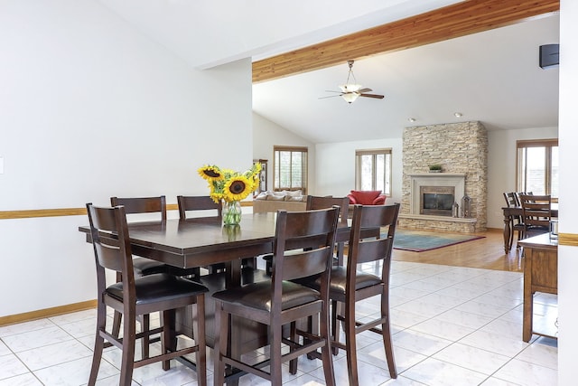8124 Glenbrook Pl, Tinley Park, IL 60487 - dining room featuring a ceiling fan, light marble finish flooring, and a stone fireplace