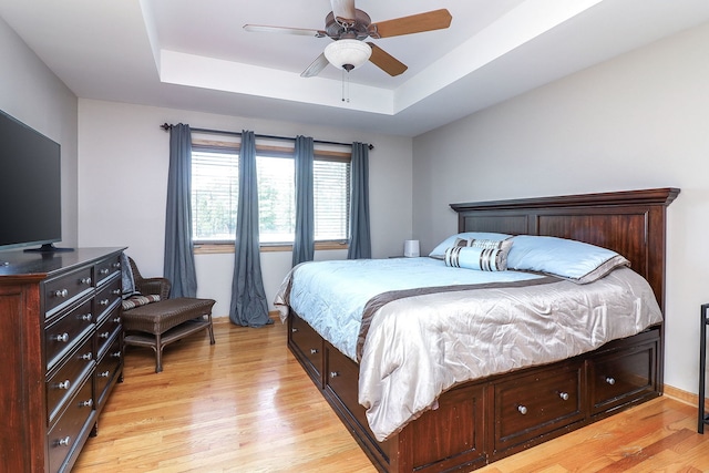 8124 Glenbrook Pl, Tinley Park, IL 60487 - bedroom featuring a raised ceiling, light wood-style floors, and a ceiling fan