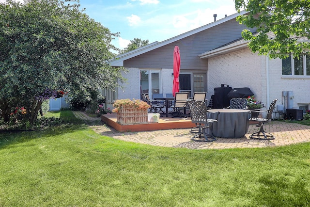 8124 Glenbrook Pl, Tinley Park, IL 60487 - back of property featuring a lawn, a wooden deck, brick siding, and a patio area