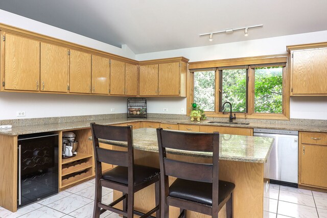 8124 Glenbrook Pl, Tinley Park, IL 60487 - kitchen featuring stainless steel dishwasher, wine cooler, light marble finish floors, a breakfast bar area, and track lighting