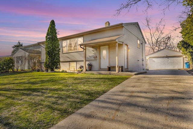 1824 Endicott Cir, Carpentersville, IL 60110 - view of front facade featuring an outbuilding, a chimney, a detached garage, and a yard