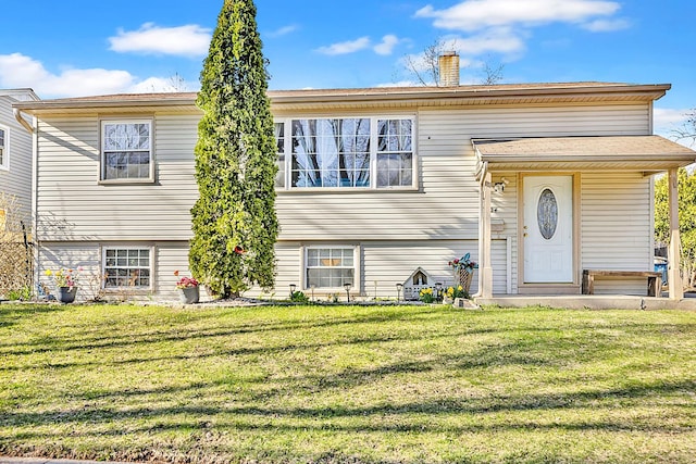 1824 Endicott Cir, Carpentersville, IL 60110 - view of front of house with a front lawn and a chimney