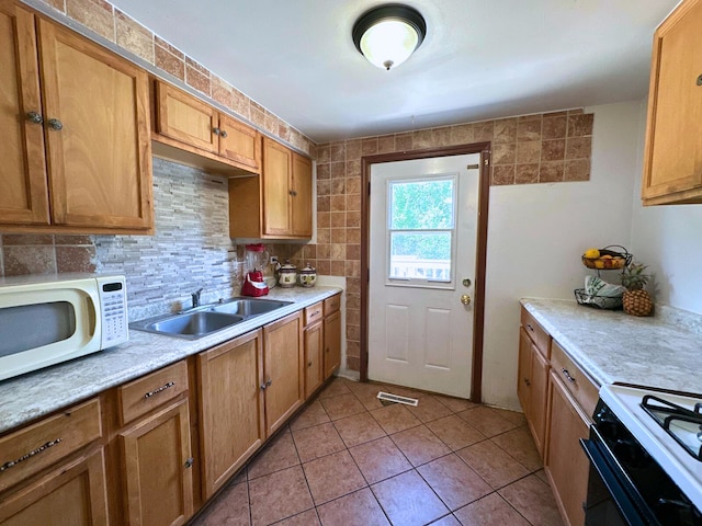 1824 Endicott Cir, Carpentersville, IL 60110 - kitchen featuring white appliances, light countertops, light tile patterned flooring, and brown cabinetry