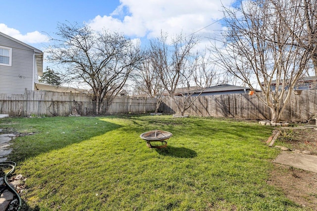 1824 Endicott Cir, Carpentersville, IL 60110 - fenced backyard with an outdoor fire pit