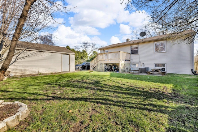 1824 Endicott Cir, Carpentersville, IL 60110 - back of house featuring a wooden deck, a lawn, and a storage unit