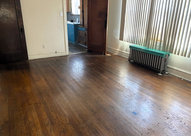 108 W 81st St, Chicago, IL 60620 - empty room featuring dark wood-style flooring, radiator heating unit, and healthy amount of natural light