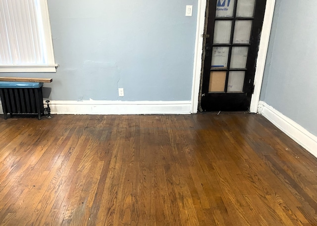 108 W 81st St, Chicago, IL 60620 - unfurnished living room with radiator heating unit and wood-type flooring