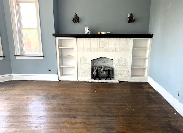 108 W 81st St, Chicago, IL 60620 - unfurnished living room with wood finished floors and a fireplace