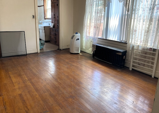 108 W 81st St, Chicago, IL 60620 - unfurnished room with radiator heating unit and wood-type flooring