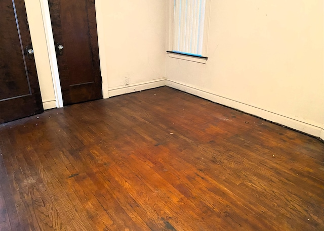 108 W 81st St, Chicago, IL 60620 - unfurnished bedroom featuring dark wood-type flooring