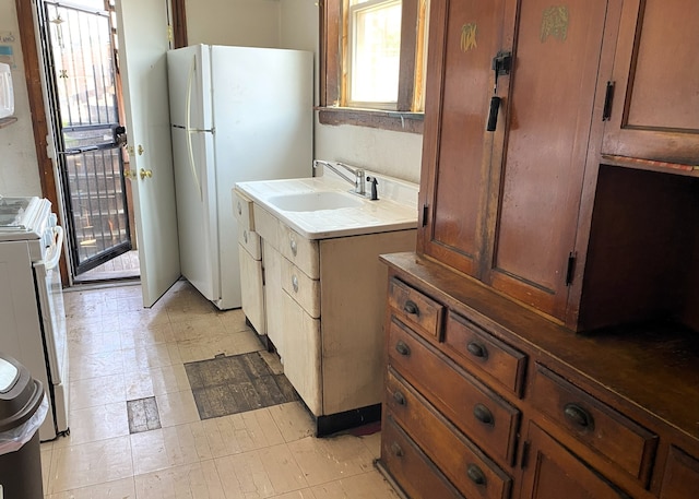 108 W 81st St, Chicago, IL 60620 - kitchen with freestanding refrigerator, range, and brown cabinetry