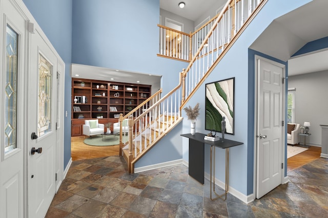 1215 Pendleton Dr, Lemont, IL 60439 - entryway featuring stone tile flooring, stairway, and a high ceiling