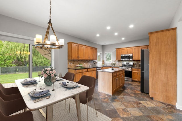 1215 Pendleton Dr, Lemont, IL 60439 - kitchen featuring appliances with stainless steel finishes, a chandelier, a kitchen island, decorative backsplash, and recessed lighting