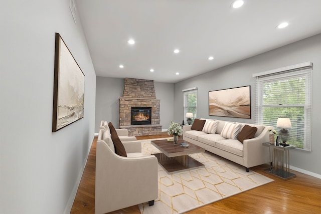 1215 Pendleton Dr, Lemont, IL 60439 - living room with light wood-style flooring, recessed lighting, and a fireplace