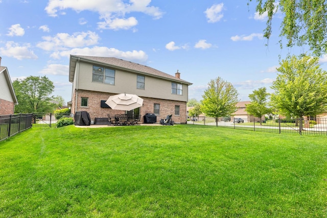 1215 Pendleton Dr, Lemont, IL 60439 - back of property with a patio, brick siding, a fenced backyard, and a chimney